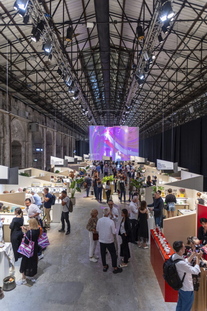 Hallway view of the fair with peoples and videoprojections